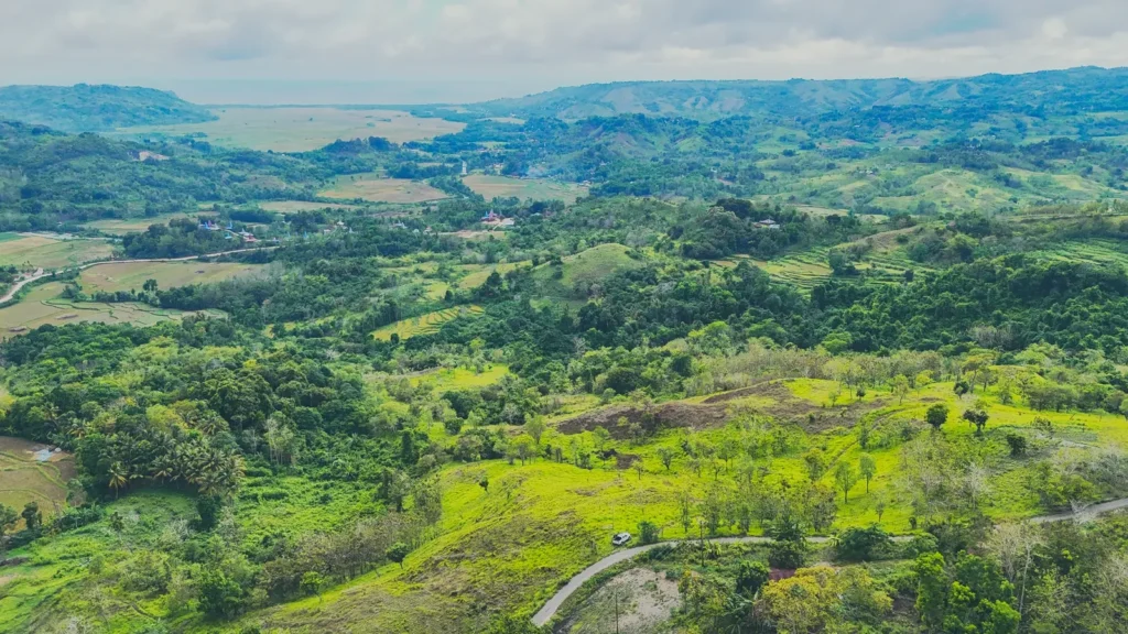 Panorama of green valleys, fields and distant hills at Lapopu, Parirara, near Lapopu, West Sumba