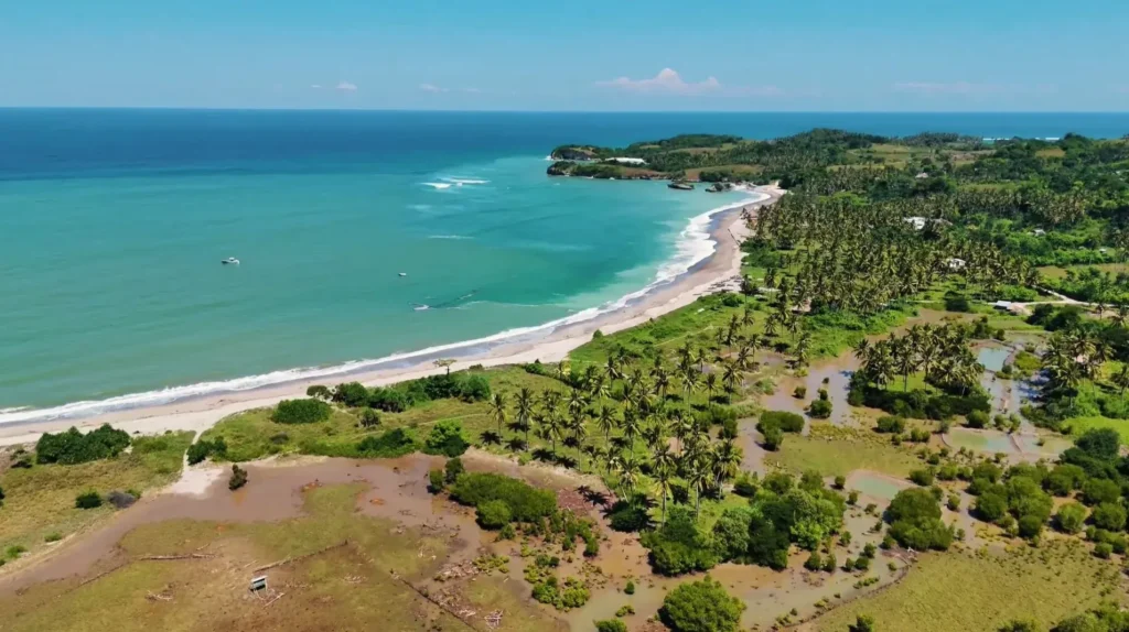 Coastal bay and green hills in the surrounding Wanokaka area, Sumba